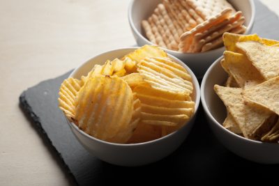 Potato chips in bowl on a table Snacks